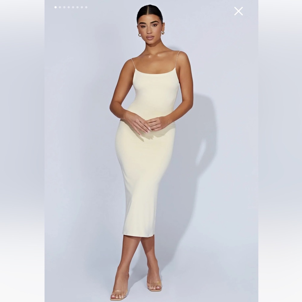 Cream/Bone colored midi dress. Feels like Skims and leaves you looking snatched.